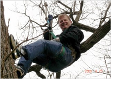 Mike Kertelits climbs a tree